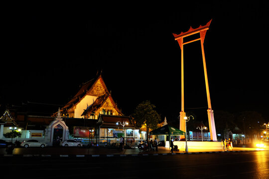 Giant Swing (Sao Ching Cha) illuminated at night beside Wat Suthat temple, Bangkok, Thailand