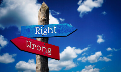 Right or wrong - wooden signpost with two arrows, sky with clouds © PX Media
