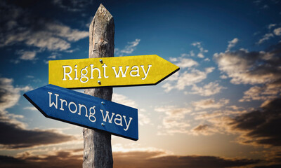 Right way or wrong way - wooden signpost with two arrows, sunset sky in background © PX Media
