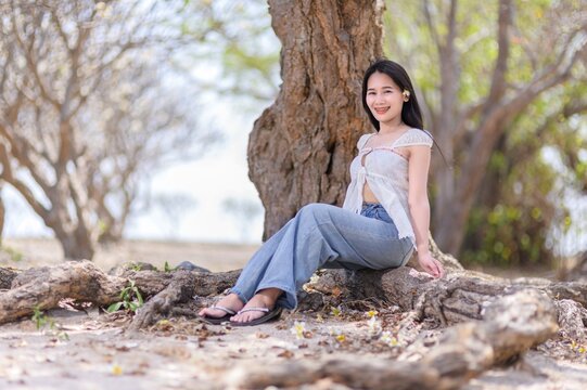 Young Woman Relaxing on Tropical Beach in Koh Si Chang, Thailand