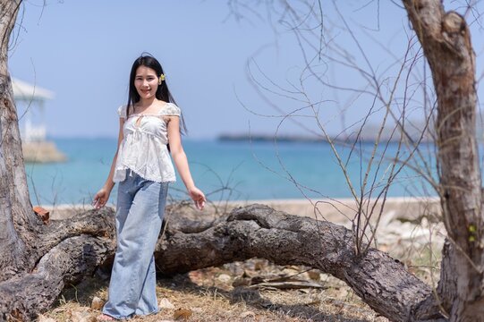 Young Woman Enjoying Vacation by the Sea in Koh Si Chang, Thailand