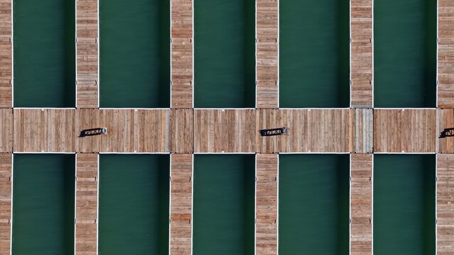 Aerial view of wooden boat slips at Carter Lake Reservoir with calm green water in Larimer County, Colorado, United States.
