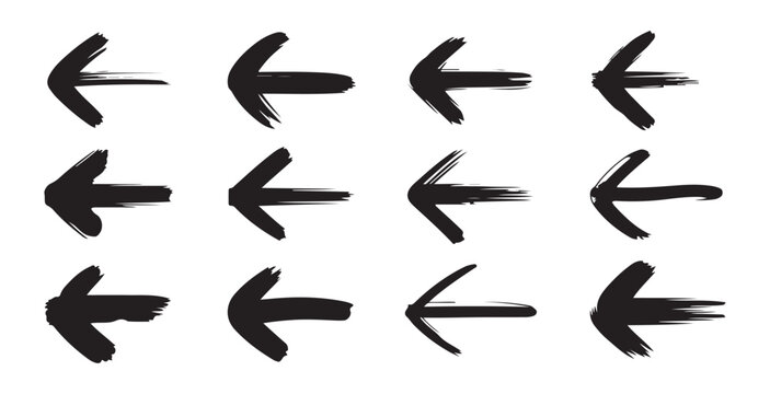 Set of black hand drawn brush stroke arrows on grid background for creative design project layout.