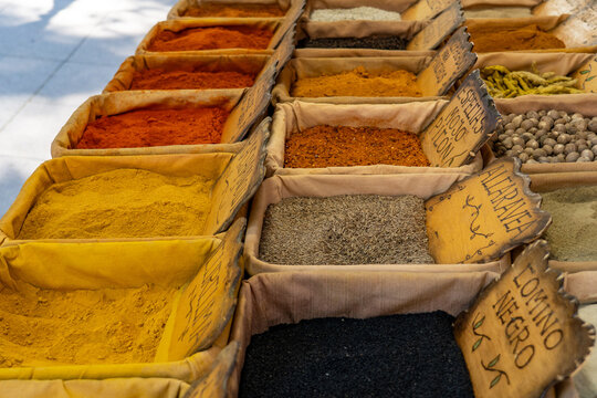 a market stall with a wide variety of spices and seasonings
