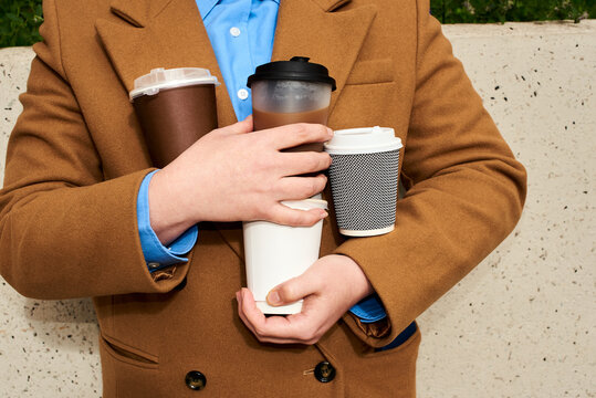 Carrying multiple cups of coffee in the city