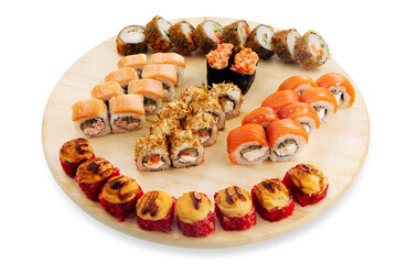 Assorted sushi rolls arranged on a round wooden serving board with salmon, seafood, vegetables, and colorful toppings, isolated food presentation © Кирилл Горшков