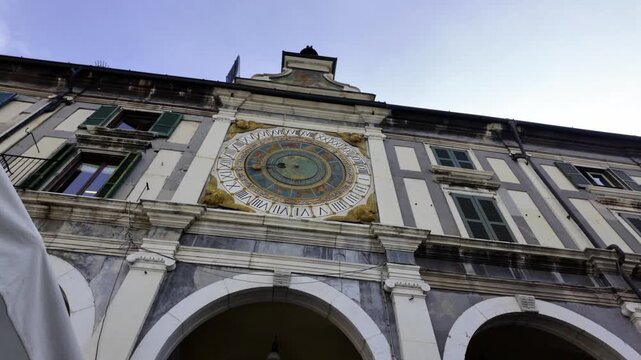 Astronomical clock on historic tower in Brescia, Lombardy, Italy