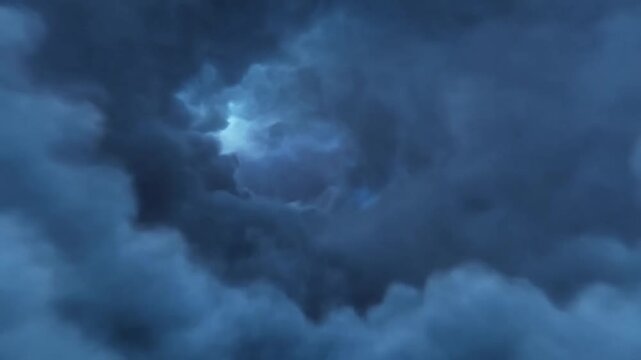 Dark storm clouds billow as lightning flickers through a blue atmospheric sky