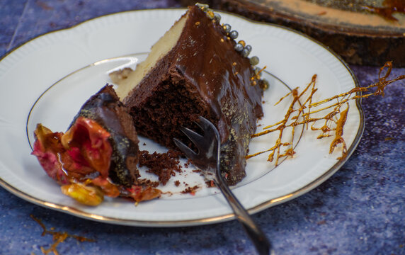 Chocolate layer cake covered in crystalized rose petals