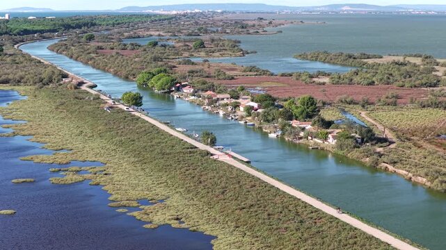Aerial view of Canal du Rh&ocirc;ne &agrave; S&egrave;te linking coastal lagoons with La Pointe Courte fishing village, South of France
