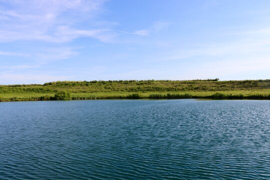 The peaceful lake in the country on a sunny day.