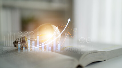 Light bulb on an open book symbolizes creativity and innovation. Financial growth graph in the background highlights the connection between knowledge and market success. Scalp © InfiniteFlow