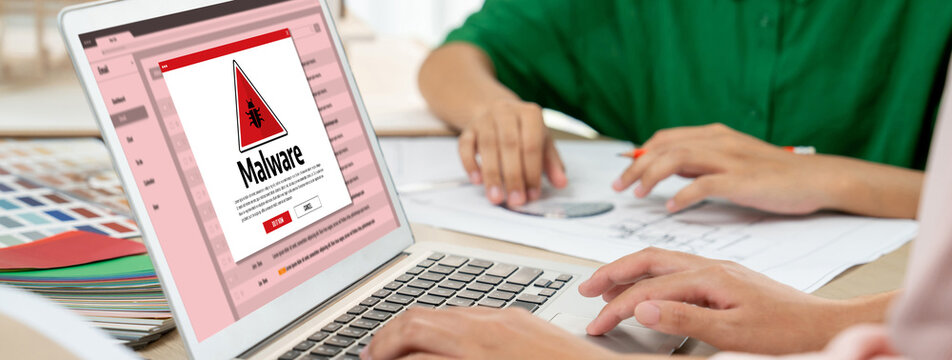 Cyber attacking concept. Malware alert showing on computer screen display scam and threat detection on computer system or online server to be removed brisk.