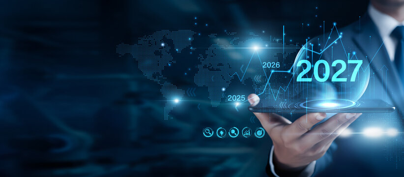 Corporate Executive Analyzing 2027 Business Growth Strategy and Financial Performance Chart on Tablet