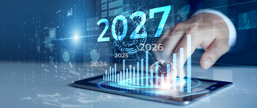 Businessman Touching Digital Tablet Displaying 2027 Vision and Financial Growth Bar Graph Analytics