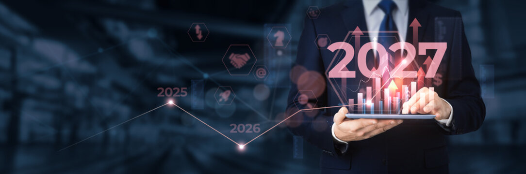 Successful Businessman Analyzing Financial Graph and Market Trends for 2027 Business Vision