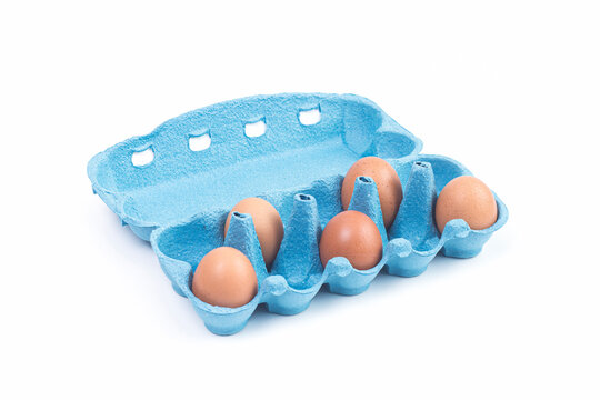 Five brown chicken eggs in an open blue cardboard egg carton on a white background, illustrating fresh food, egg packaging, grocery shopping, poultry products and everyday cooking ingredients.
