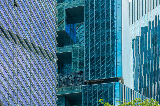 Abstract architecture background, geometric pattern, structural detail and contemporary urban design. Modern building facades with repeating windows, glass panels and vertical lines in Shenzhen city