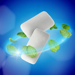 Menthol chewing gum pieces and mint leaves in air against blue background © New Africa