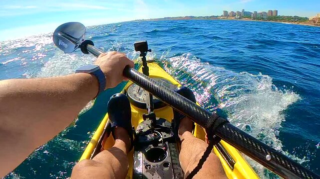 First person POV shot of kayak bow cutting through ocean wave with water splashing in slow motion