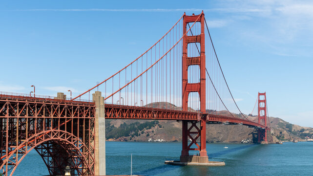 Golden Gate Bridge in San Francisco, California, USA, seen from the south end, with its red steel arch over Fort Point and the south tower above the bay