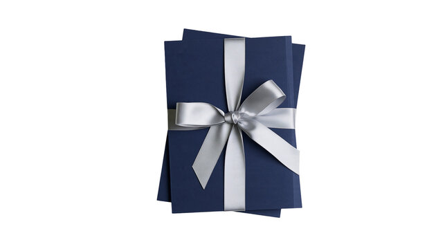 Isolated stack of elegant dark blue gift cards tied with a shiny silver ribbon bow