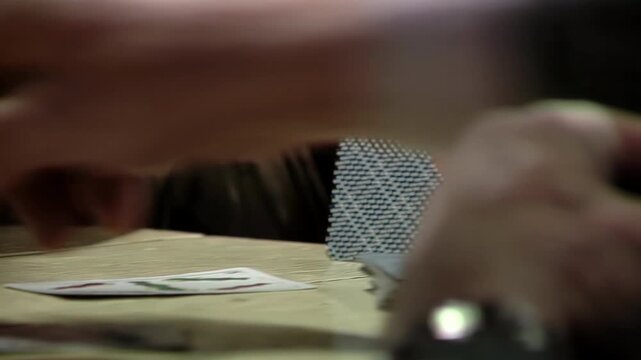 Close Up View of Senior Man Throwing Card on Table in Truco Game - 4K