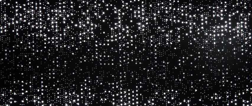 White points of light shimmer in shifting scattered patterns against a dark background