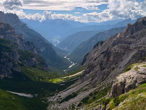 Deep mountain valley between steep rocky peaks