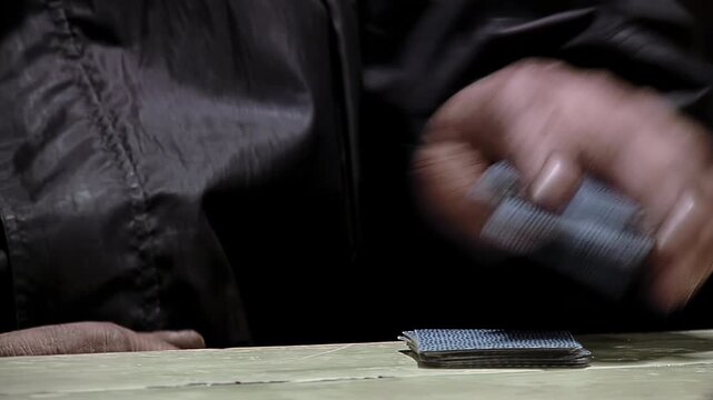 Close Up View of Senior Hands Shuffling and Dealing Cards in Truco Game - 4K