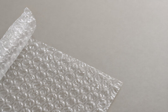 Folded clear bubble wrap sheet on neutral surface