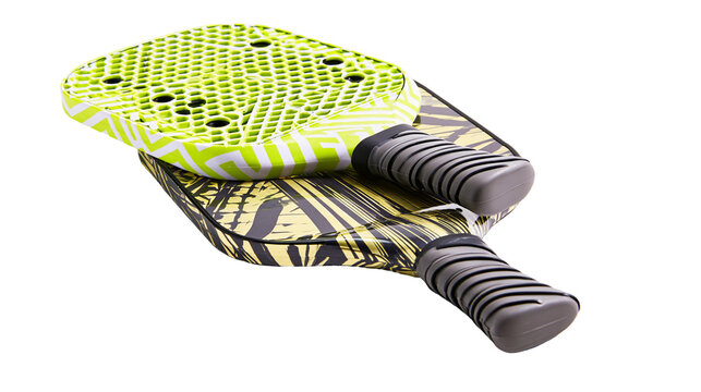 Isolated pair of vibrant beach tennis rackets with tropical patterns for active summer fun