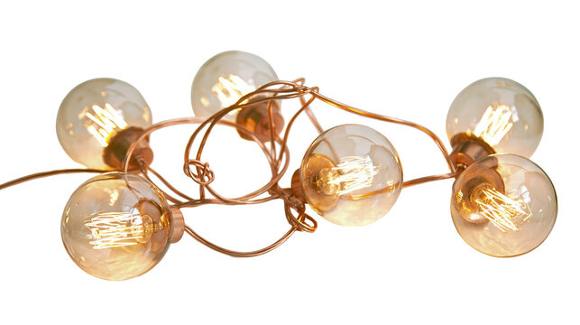 Isolated decorative string lights featuring glowing vintage Edison bulbs and twisted copper wires