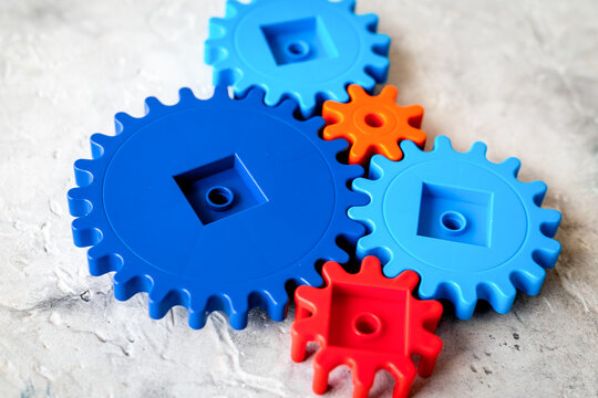 Moving forward concept with gears. Right decision and correct solution. stone desk background