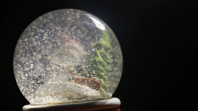 Christmas Holiday Snow Globe Off Center with Dark Background Video