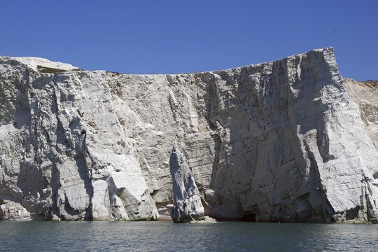 Impressive white chalk cliffs rise boldly from the sea, Beachy Head Cliffs, English Channel, Eastbourne, Sussex, England, United Kingdom