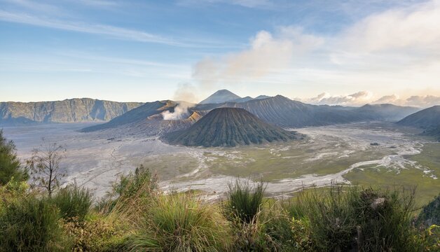 View of volcanic landscape, volcanoes, smoking volcano Gunung Bromo, Mt. Batok, Mt. Kursi, Mt. Gunung Semeru, Bromo-Tengger-Semeru National Park, Java, Indonesia