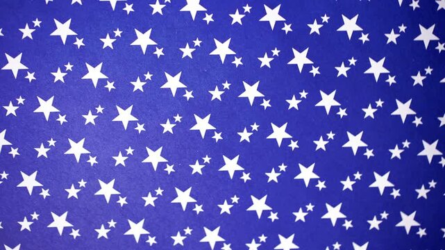 Rotating White Stars on Blue Background Motion Video Footage
