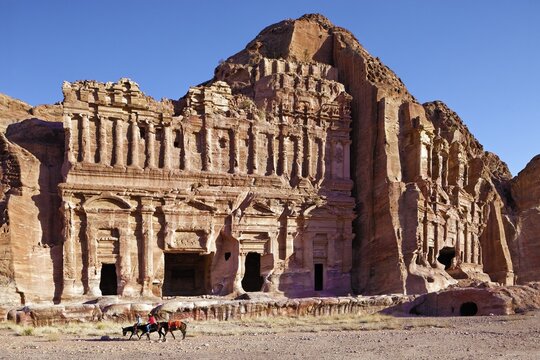 Royal tombs on the western slope of Jabal al-Khubtha, rider on donkey (Equus asinus asinus), two, Petra, ancient capital of the Nabataeans, UNESCO World Heritage Site, Kingdom of Jordan