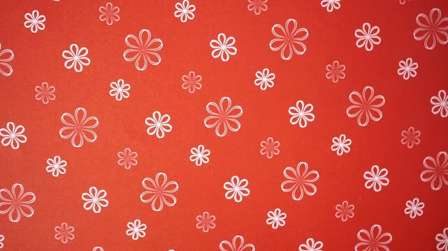 Rotating White Flower Outline Pattern on Red Background Motion Video