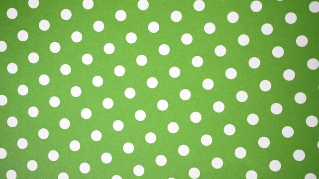 Continuous Panning Green and White Polka Dot Pattern Background Video