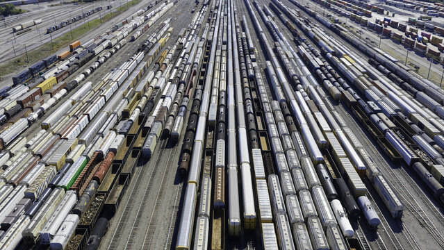 Aerial view of CSX's Radnor Yard and Nashville Intermodal train terminal featuring numerous freight train cars arranged on parallel tracks in Nashville, TN, United States.