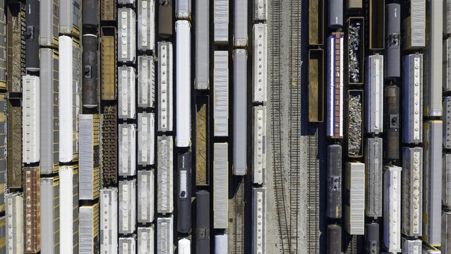 Aerial view of CSX's Radnor Yard and Nashville Intermodal train terminal featuring numerous freight train cars parked on parallel tracks in Nashville, TN, United States.