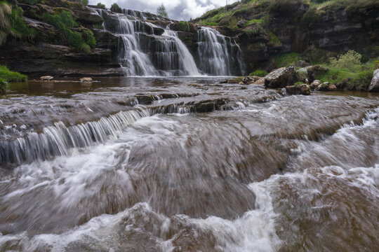 Cascada del Guarguero Waterfall Flowing Over Rocky Terraces in Cantabria, Spain