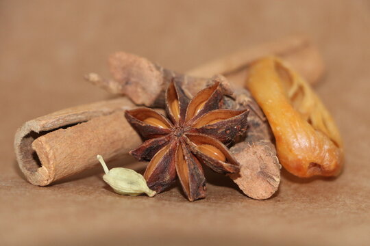 Assorted spices with star anise, cinnamon stick, cardamom and mace