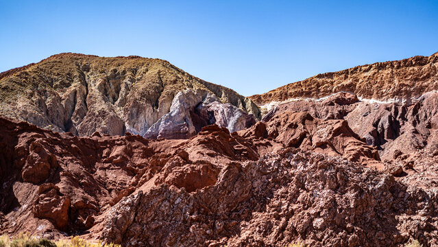 Pre-Hispanic archaeological site with ancient rock art in Rainbow Valley, Atacama Desert.