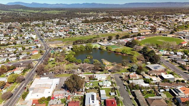 Stawell, Victoria, Australia &ndash; 4K aerial drone view of Cato Park lake, landscaped gardens, bowling greens, historic town centre and residential neighbourhoods near the Grampians
