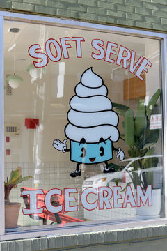 exterior building and retro window signage at Super Serve, an ice cream shop, located at 562 Dundas St W, Toronto (northwest corner of Kensington Av)