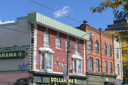 historic building and sign of Dollarama, a dollar store chain, located here at 1220 Dundas St W, Toronto