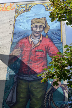 "The Portuguese Fisherman" by Pablo Westo on the wall    outside 1359 Dundas St W, Toronto